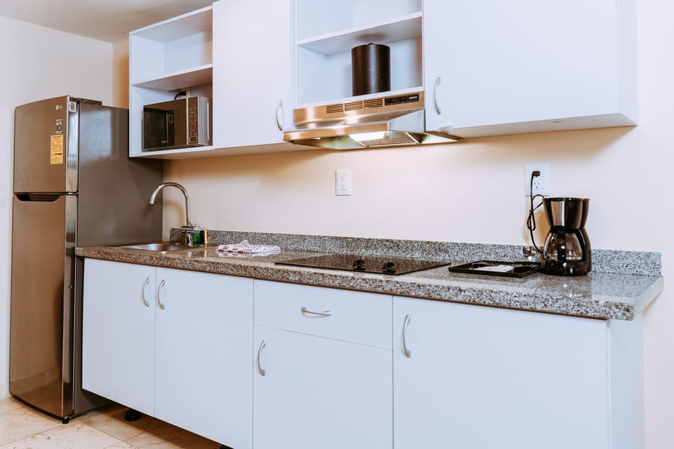 Microwave, coffee/tea maker, dining tables