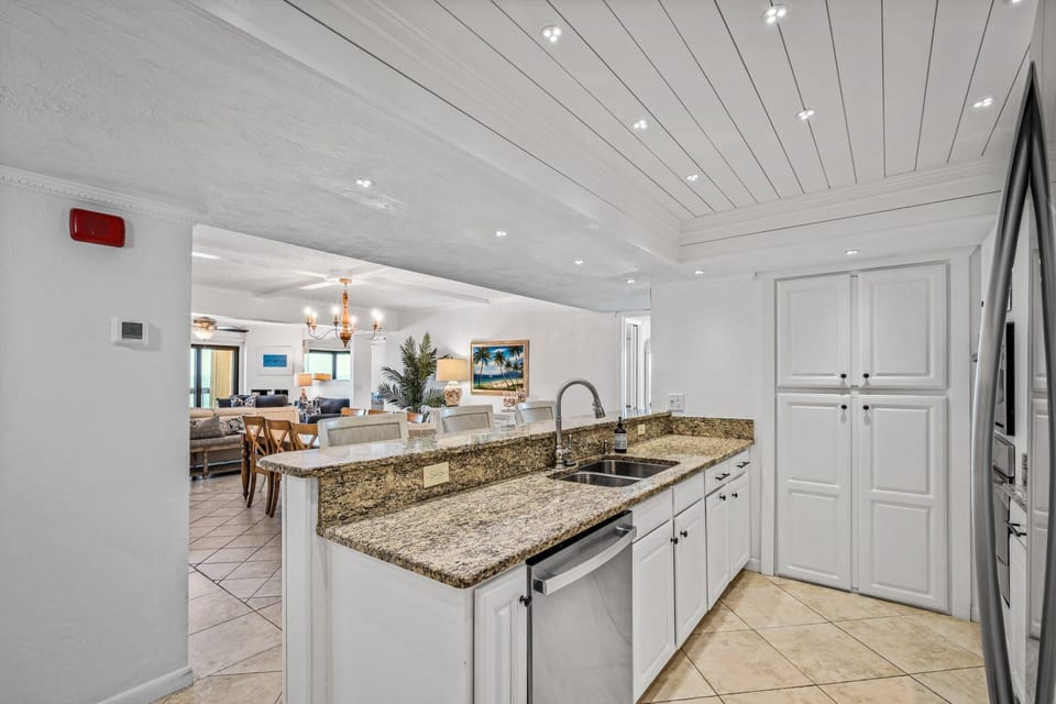 Stunning kitchen with granite counters and a large pantry area