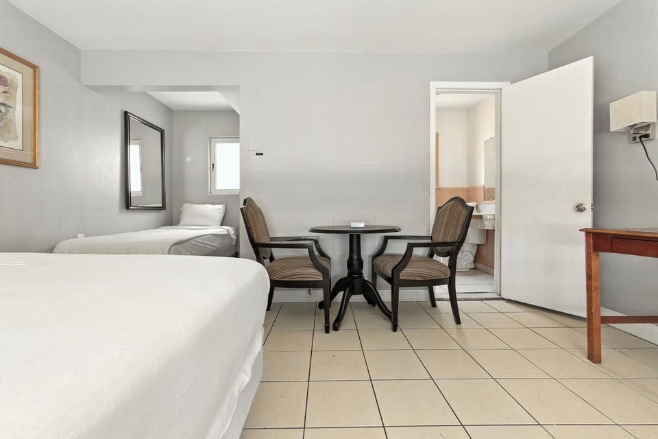 Basic Double or Twin Room, Multiple Beds | Laptop workspace, iron/ironing board, free WiFi, bed sheets