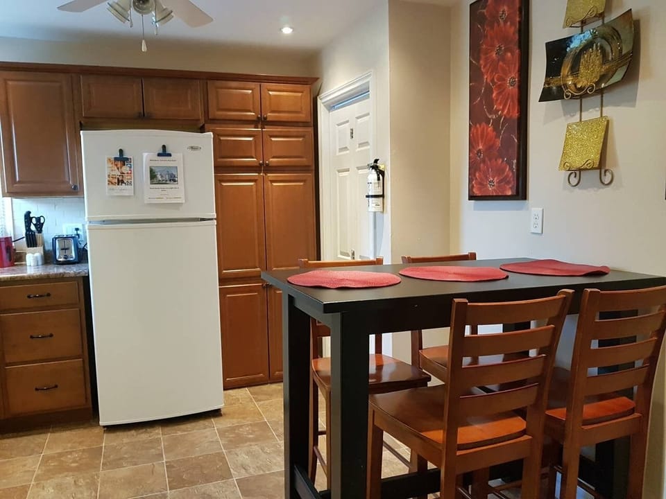 Spacious kitchen with full size appliances and updated cabinetry offering plenty of storage solutions.