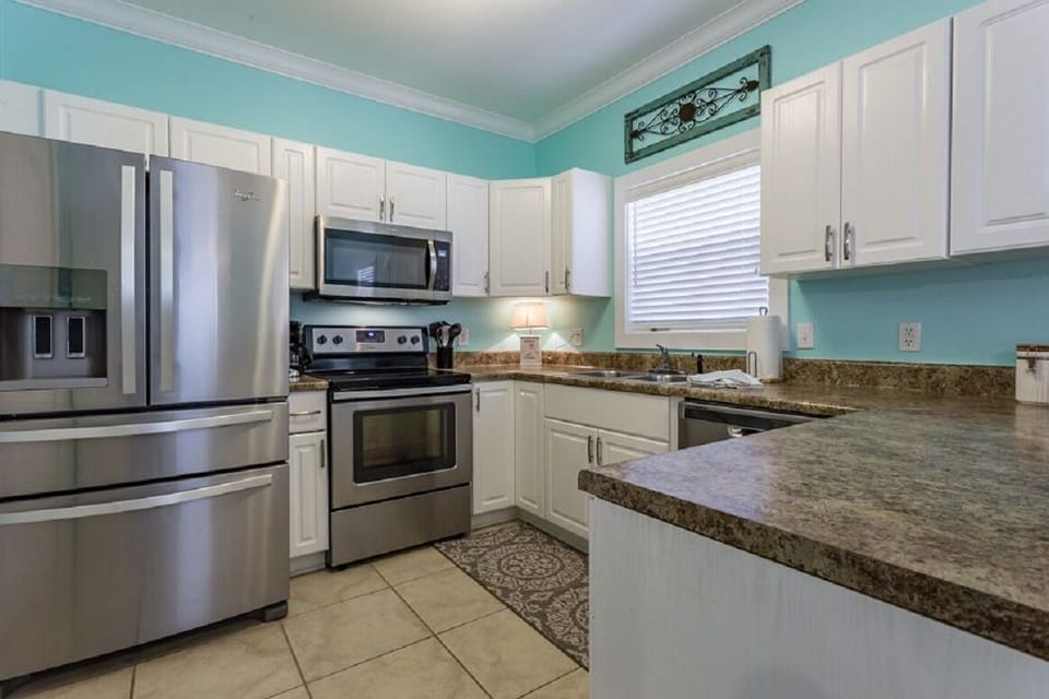 Entering into the kitchen, note new stainless appliances