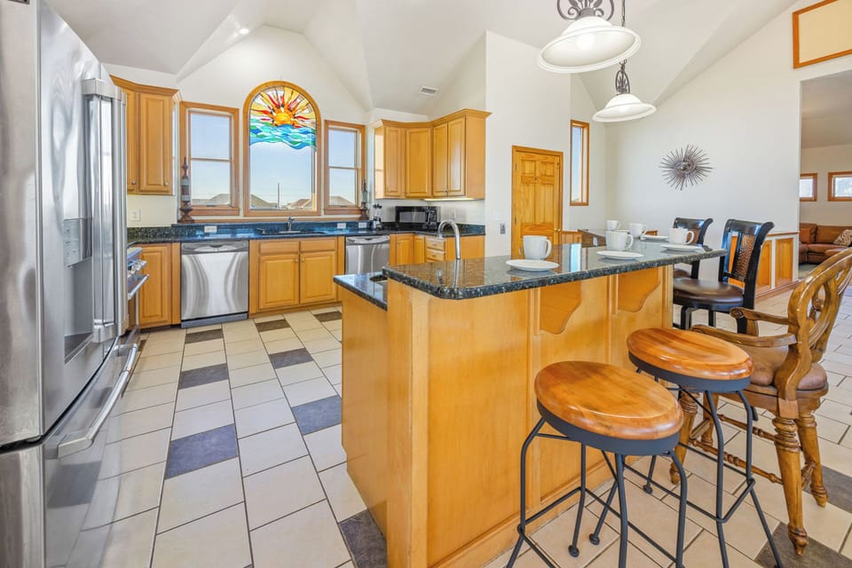 The well-equipped kitchen with stainless steel appliances, 2 dishwashers, and ice machine make cooking a delight.