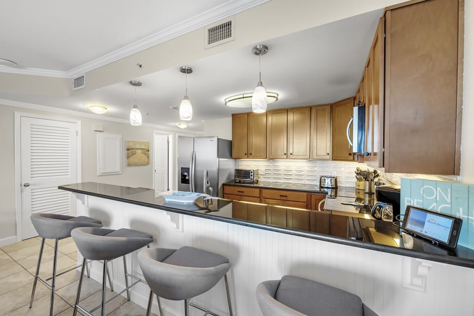 Full Size Kitchen with Granite Countertops, Stainless Steel Appliances and Extra Seating at the Breakfast Bar