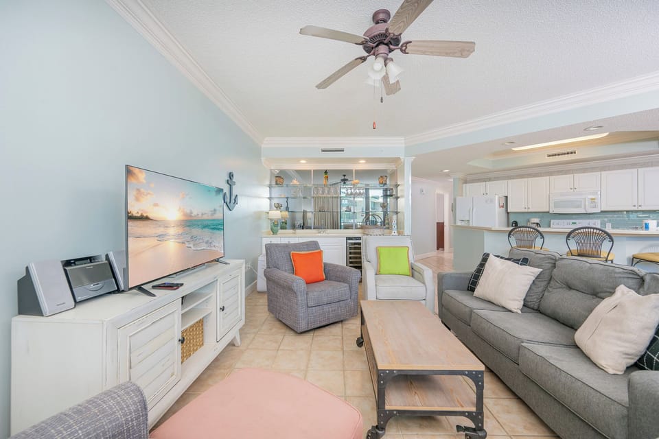 Relax on the plush seating as you chat and enjoy the coastal air, with a sleek TV ready for your favorite shows
