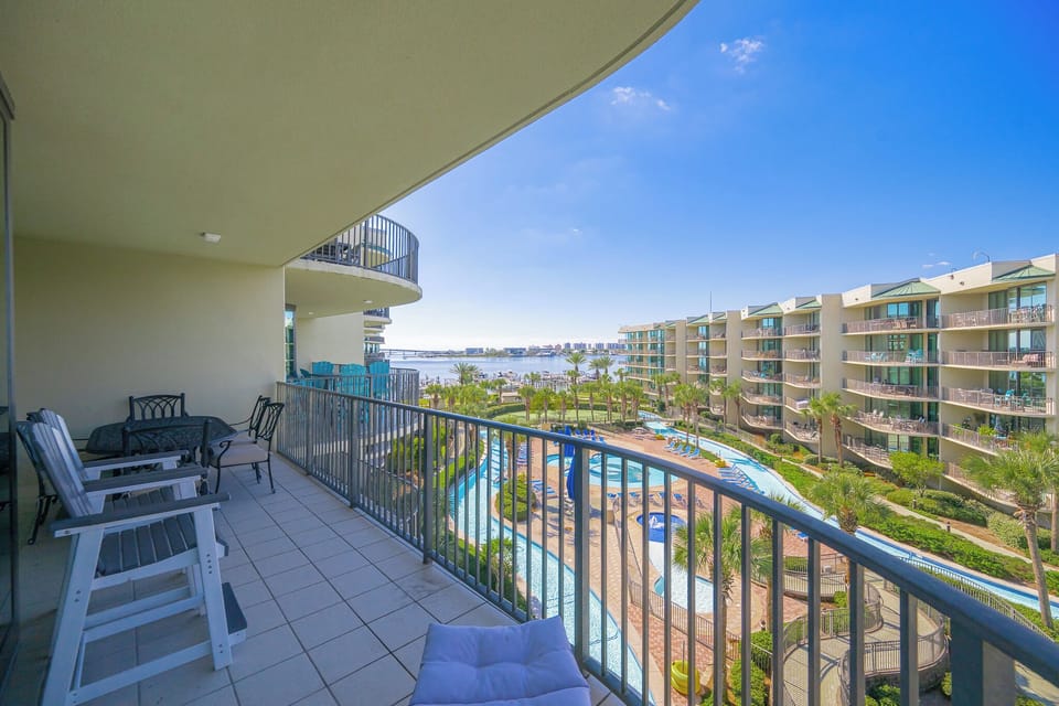 Enjoy the warm breeze from the balcony while soaking in the vibrant coastal views and lush garden landscape below