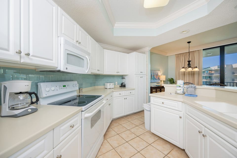 Craft refreshing meals in this kitchen, surrounded by elegant decor, and enjoy coastal views