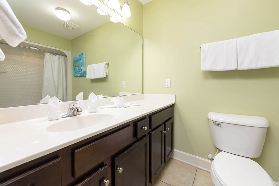 Refresh in this guest bathroom, where you can enjoy a revitalizing shower and serene coastal-inspired decor