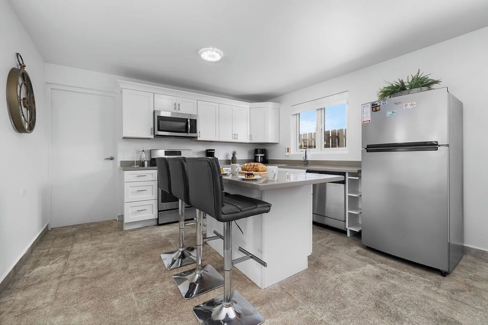 Light-filled kitchen with a kitchen bar, perfect for casual dining.