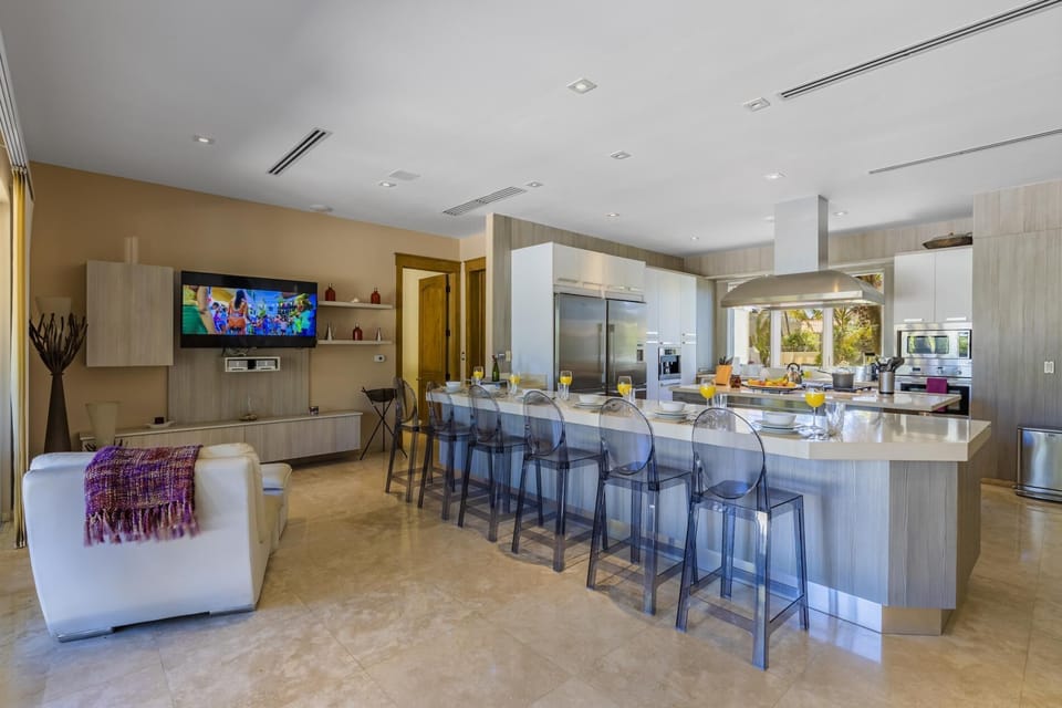 Large kitchen area with all equipment and dining table.