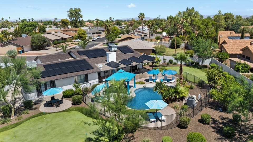 Outdoor oasis at the Turquiose House West including 2 large putting greens, pool