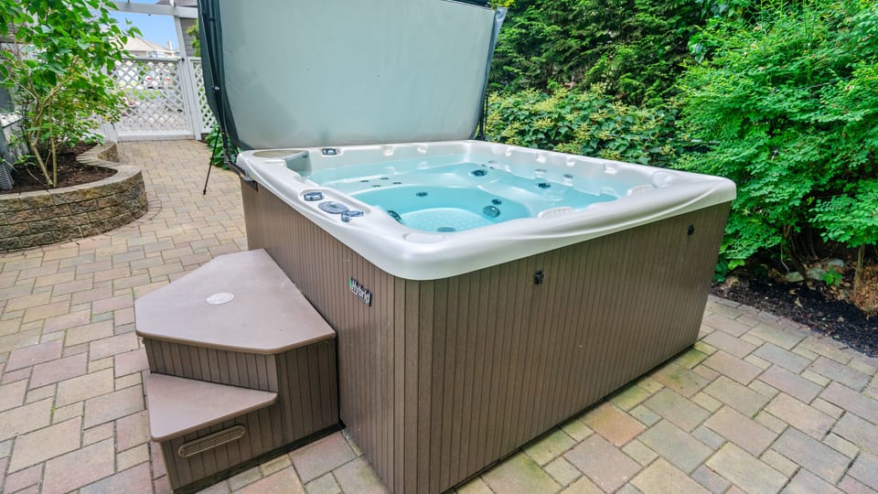 The hot tub is only steps away from the suite's front entrance.