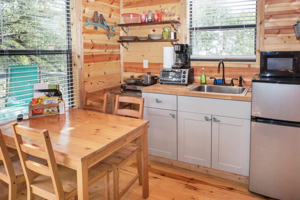 The dining table and kitchenette.