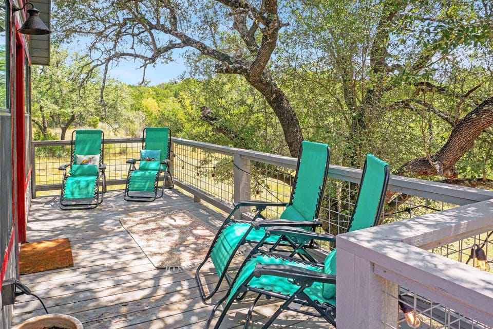 Abundant deck seating right in the trees.