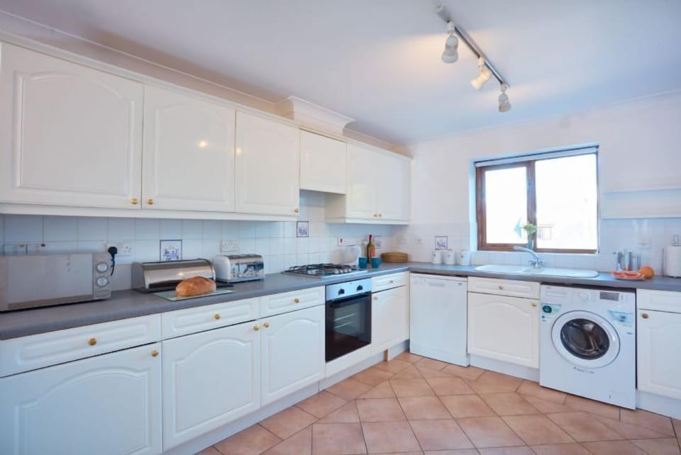 Trevells, Roserrow. First floor: Including an electric oven, gas hob, refrigerator, freezer, microwave, dishwasher, and washing machine