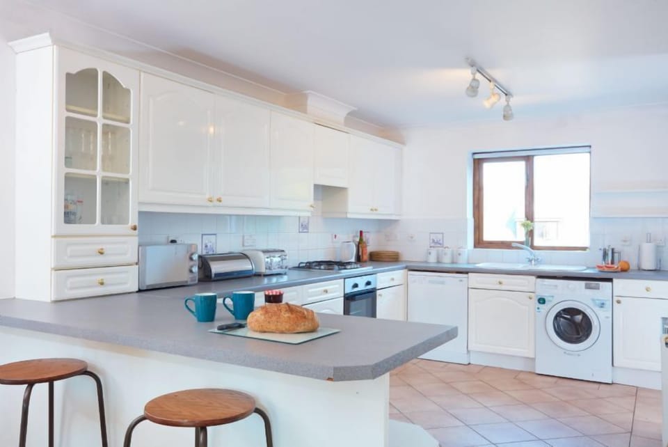 Trevells, Roserrow. First floor: The kitchen is fully equipped with all the holiday essentials