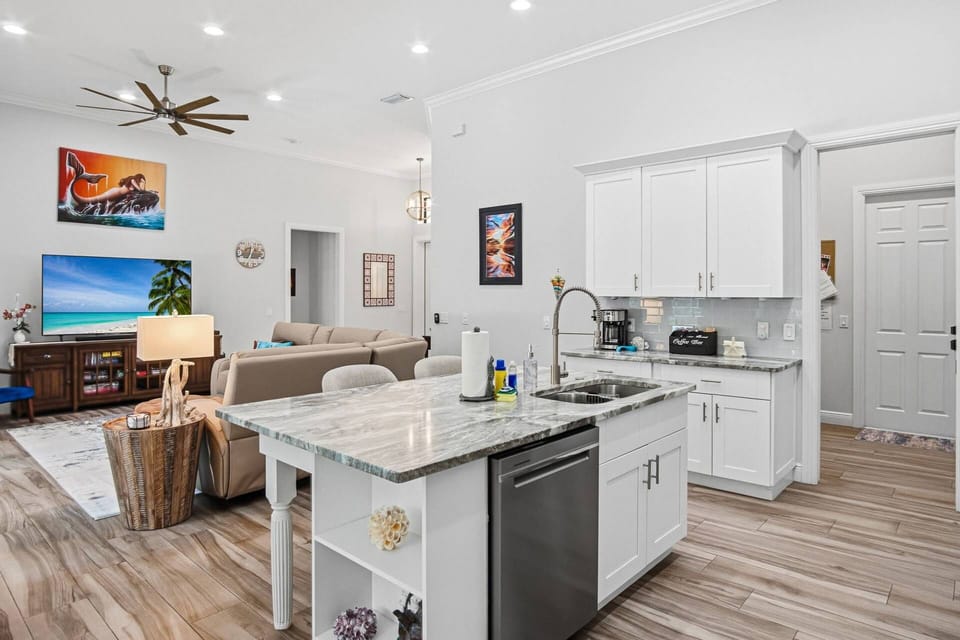 Enjoy conversing with those gathered at the island or the show on TV in the living room while preparing a meal.