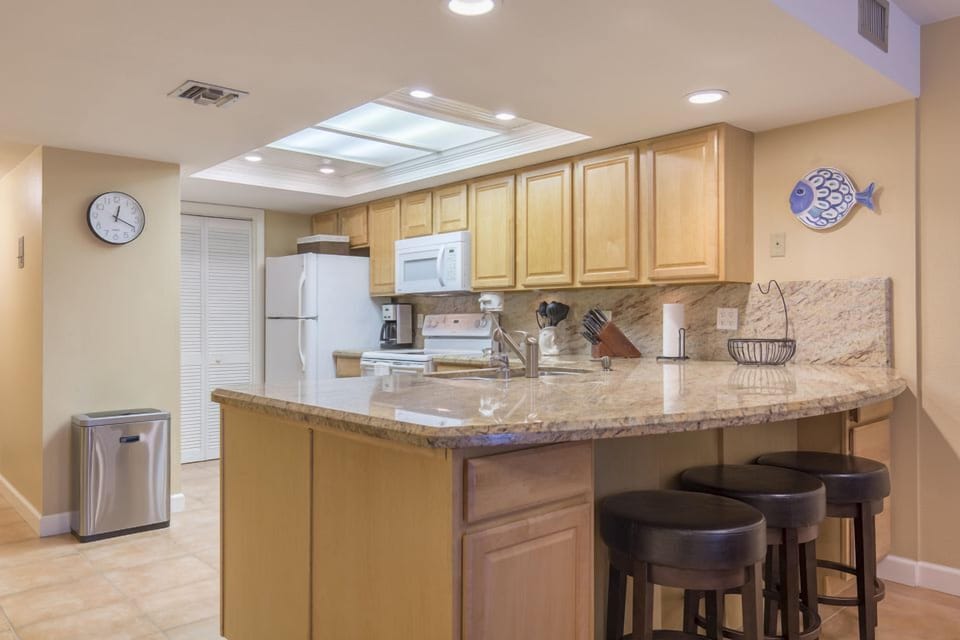 Enjoy the full, sun-filled kitchen space that over looks the breakfast bar, dining, and living areas, as well as the beachfront view.