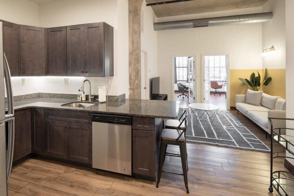 Enjoy home-cooked or the neighborhood's best takeout in this lovely kitchen with stainless steel appliances and a full-sized refrigerator.