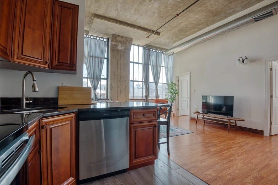 Enjoy home-cooked or the neighborhood's best takeout in this lovely kitchen with stainless steel appliances, a microwave, and a full-sized refrigerator