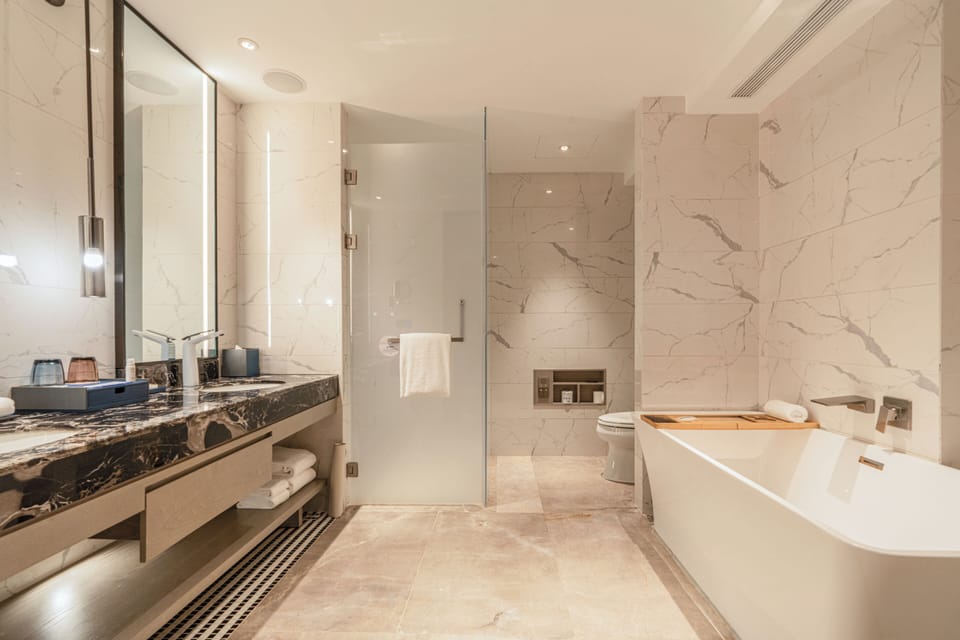 Suite, 2 Bedrooms, City View (Kids Suite) | Bathroom | Rainfall showerhead, designer toiletries, hair dryer, bathrobes