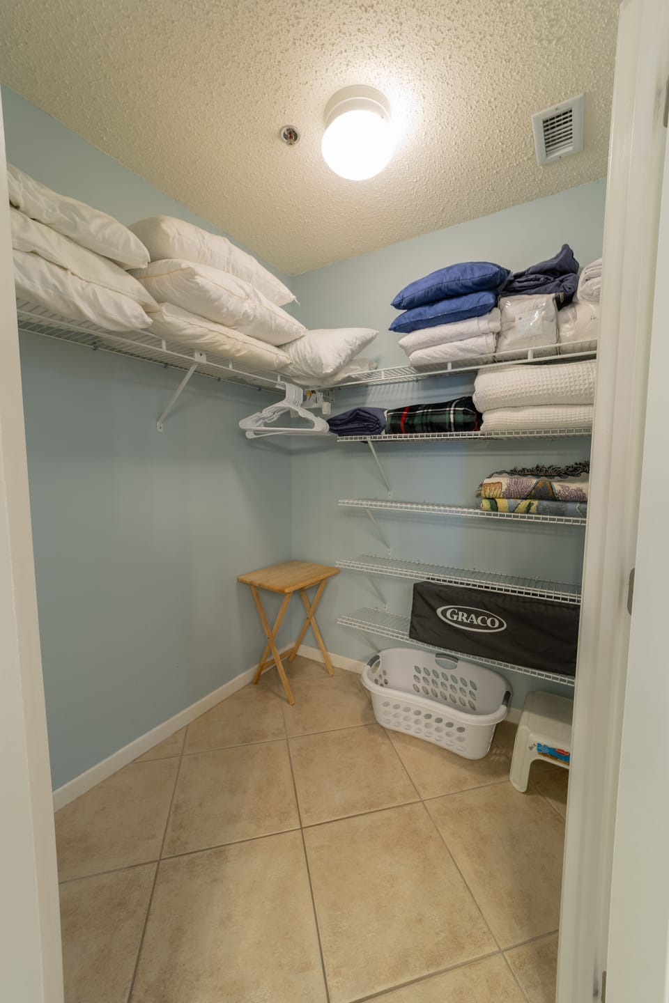Master Closet with extra pillows and pack n play