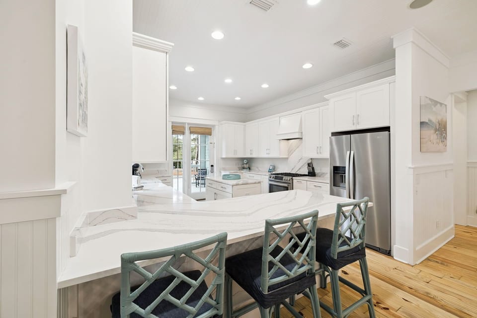 Your gourmet kitchen awaits with marble countertops, premium appliances, and a spacious island perfect for morning coffee or evening meals.