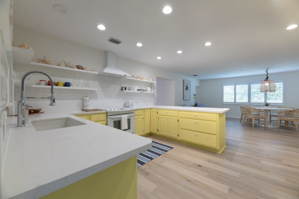 A fully- equipped chef's kitchen. 4 Counter stools at the kitchen counter, and direct access to the screened patio.