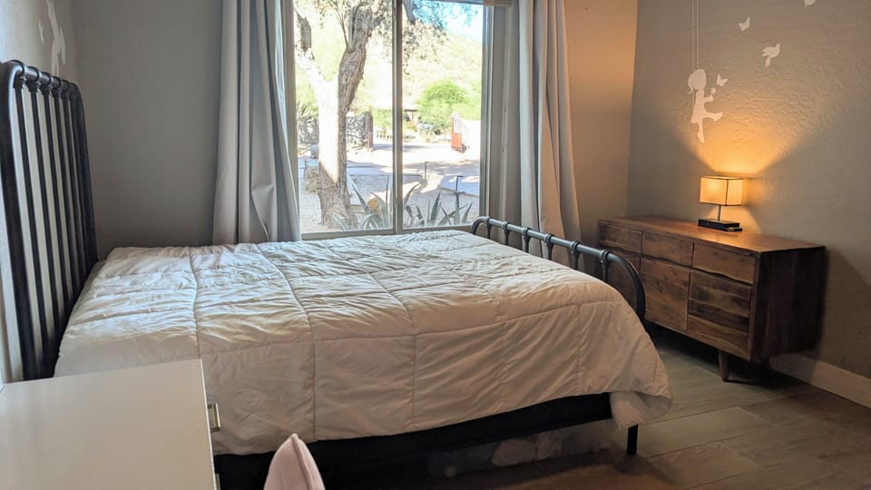 Bedroom with a mountain view and queen bed.  Pack-n-Play provided too