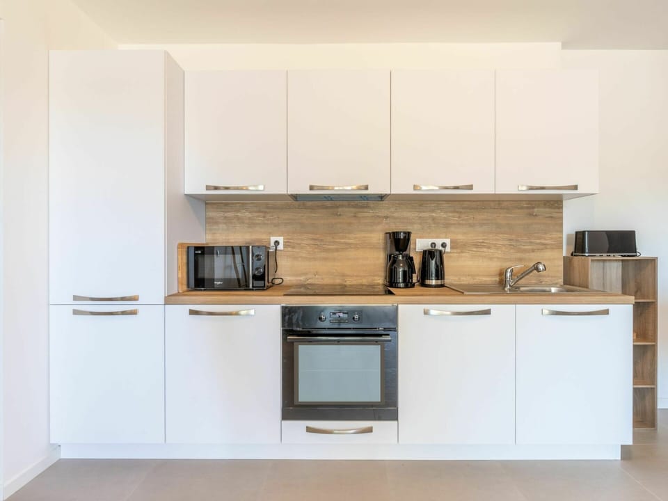 Cabinetry, Property, Countertop, Wood, Kitchen, Kitchen Stove, Kitchen Appliance, Interior Design, Wood Stain, Flooring