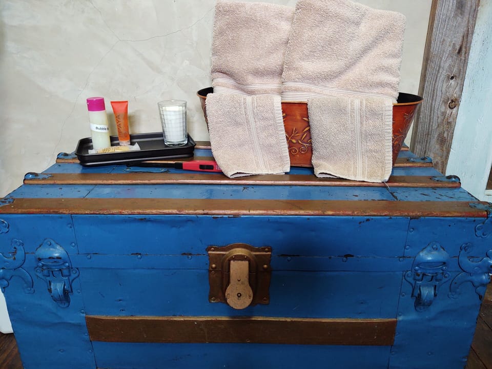 Towels & cotton linens a plenty.  Bubble bath, shampoo & that perfect candle.