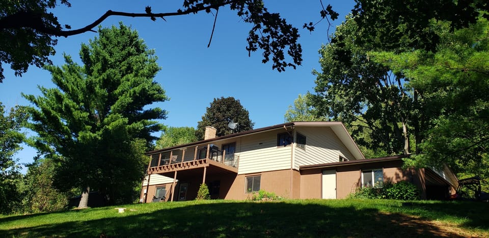 A large deck and covered patio overlooking the Coulee Bluffs