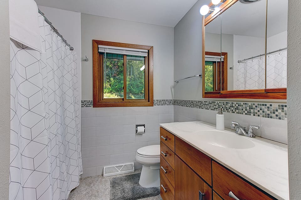 Newly remodeled upstairs bathroom with shower/tub combo. Essentials provided.