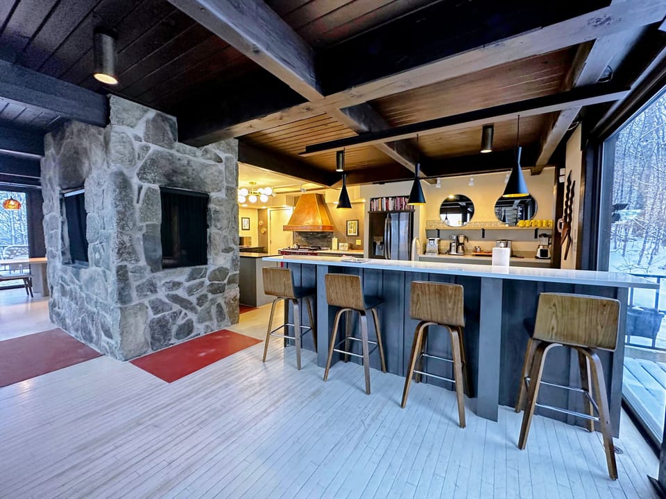 High-end kitchen with 48-inch range, fireplace grill, two dishwashers, and premium appliances