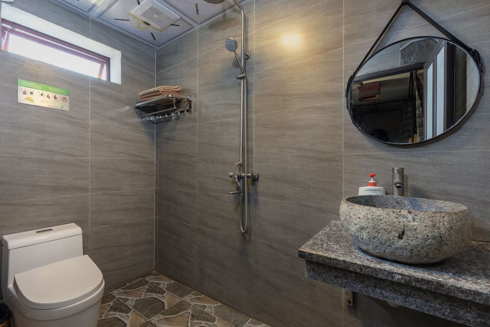 Bed in Mixed Dormitory, Shared Bathroom | Bathroom | Shower, rainfall showerhead, hair dryer, slippers