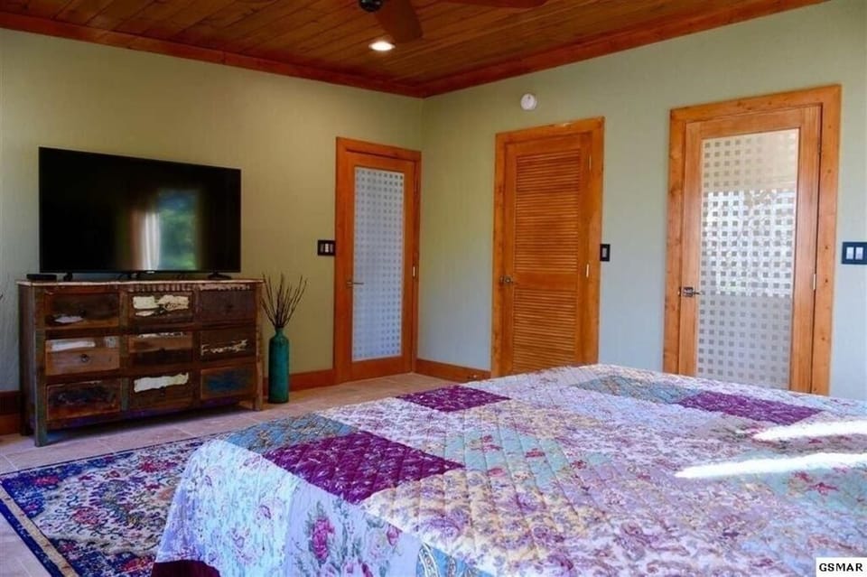 Bedroom two - large closet and king bed with en suite bath, smart TV. 