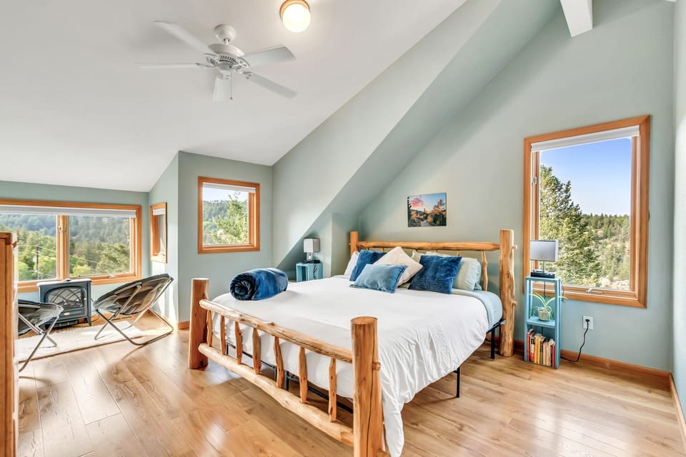 Master bedroom with views of the continental divide and sugarloaf mountain. King