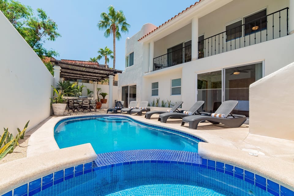 Inviting outdoor terrace with swimming pool, jacuzzi and patio furniture