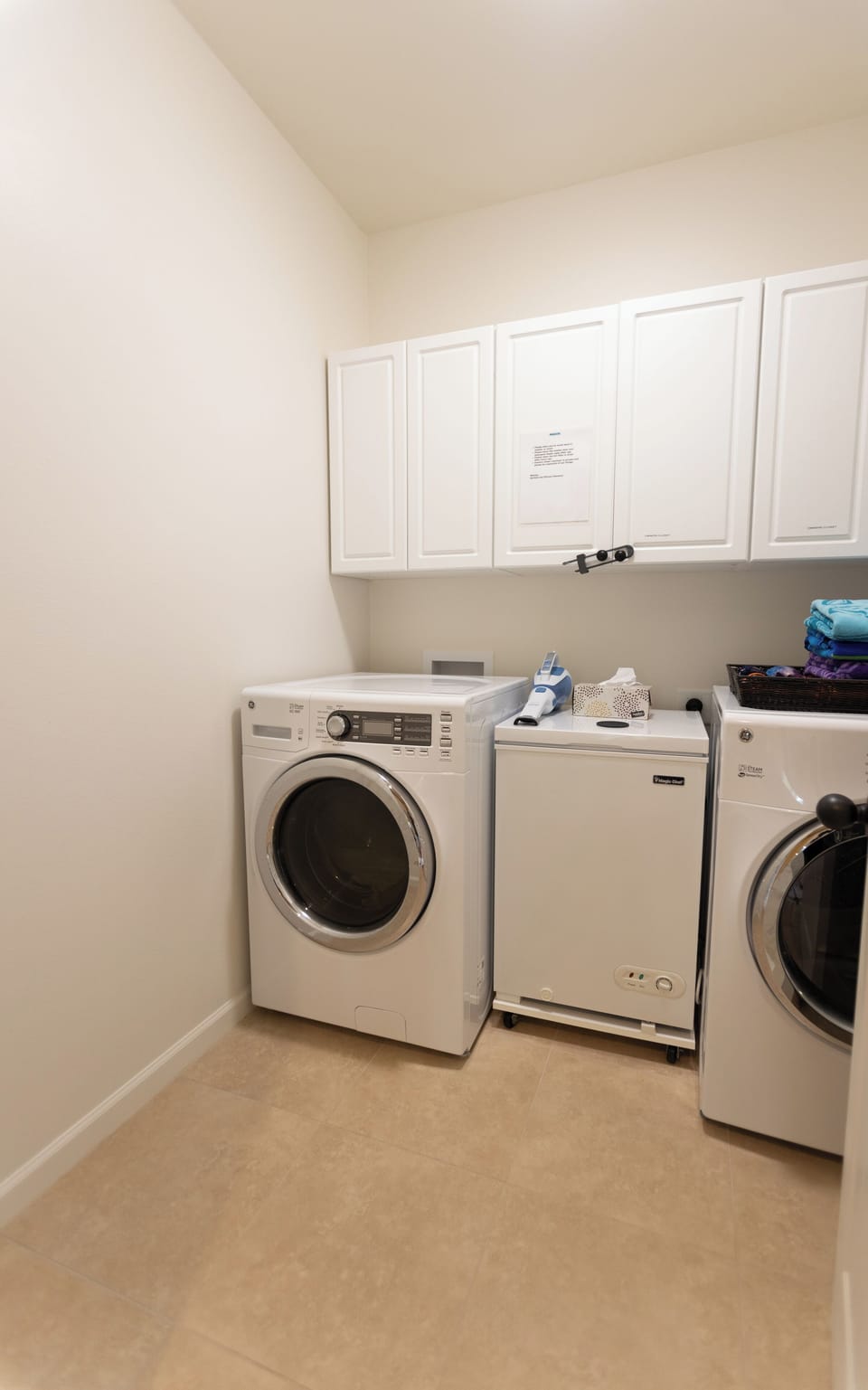 Convenient in-home laundry with a full-size washer, dryer, and storage space.