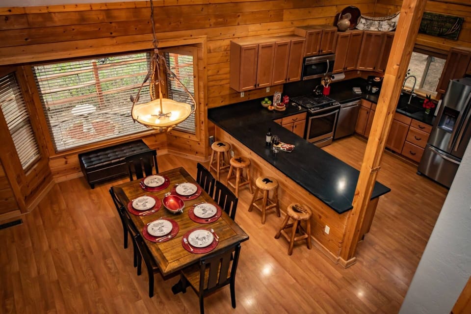 Hardwood floors and stunning black granite throughout kitchen and dining area. Equipped with all stainless steel appliances and grilling patio.