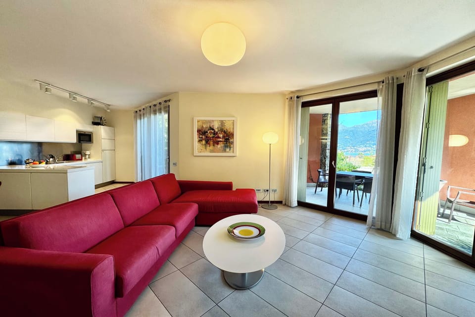 Honeymoon Apartment, Multiple Bedrooms, 2 Bathrooms, Mountainside (La Perla Di Sonenga - Giardino) | Living area | Flat-screen TV