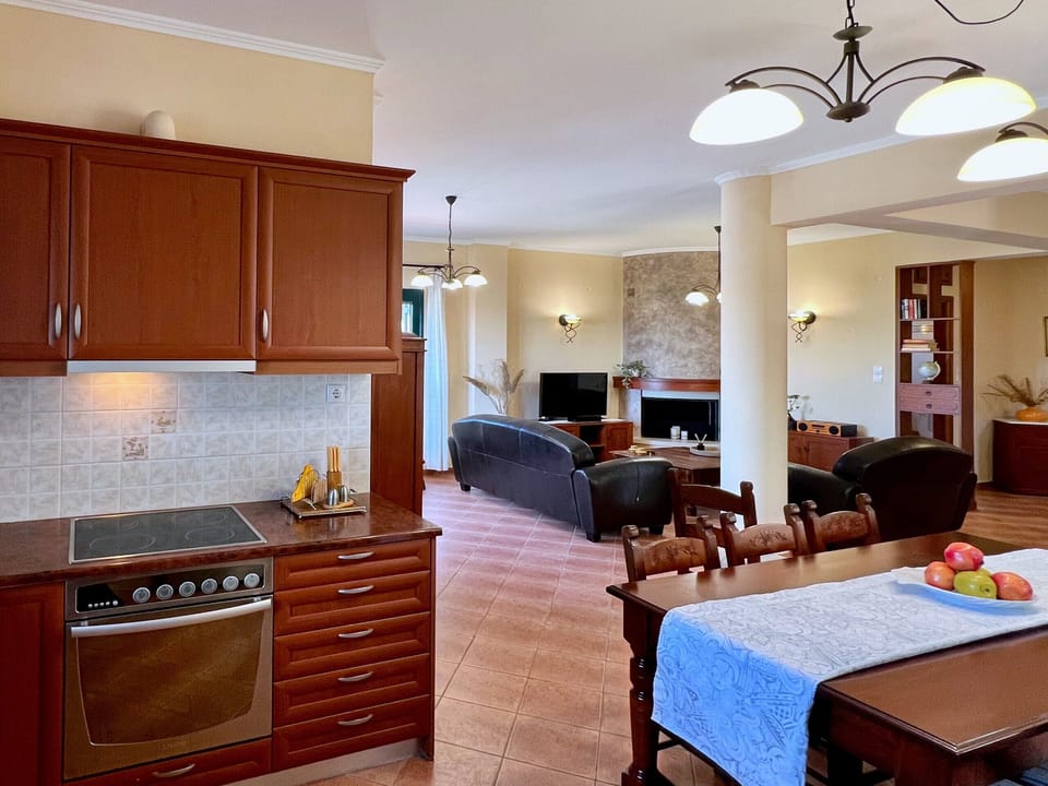 Villa Artemis, Crete, Vrises, view from the kitchen to the living area  with fire place