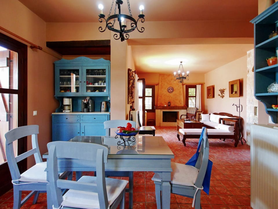 Villa Galania, Armeni, Crete; View from dining area to living room with fire place