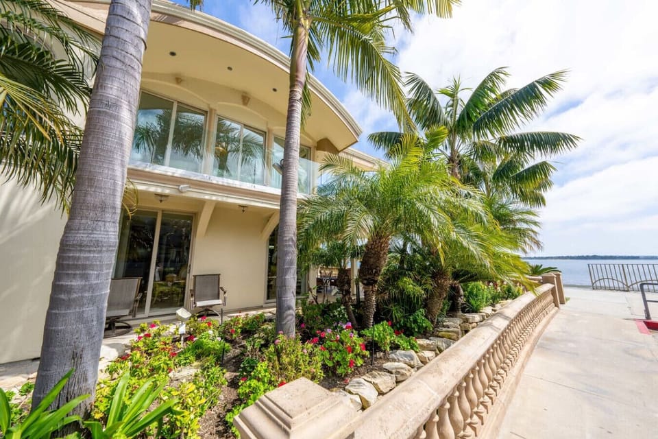 Lush waterfront exterior just steps from the bay.