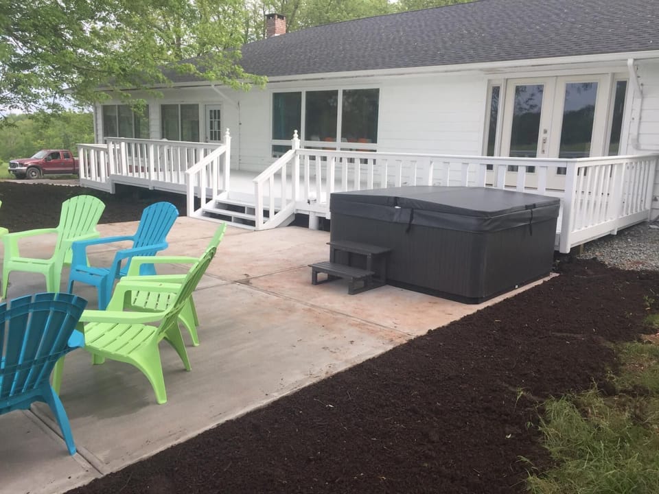 Deck, patio with hot tub, firepit and grill (not shown)