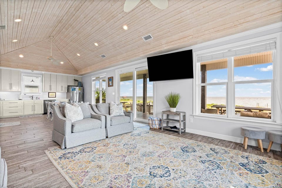 The Blue Crab Living Area With TV and Beach View