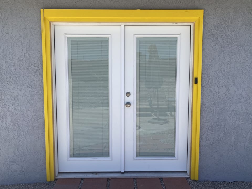 French doors with built in blinds for your own private entry. 
