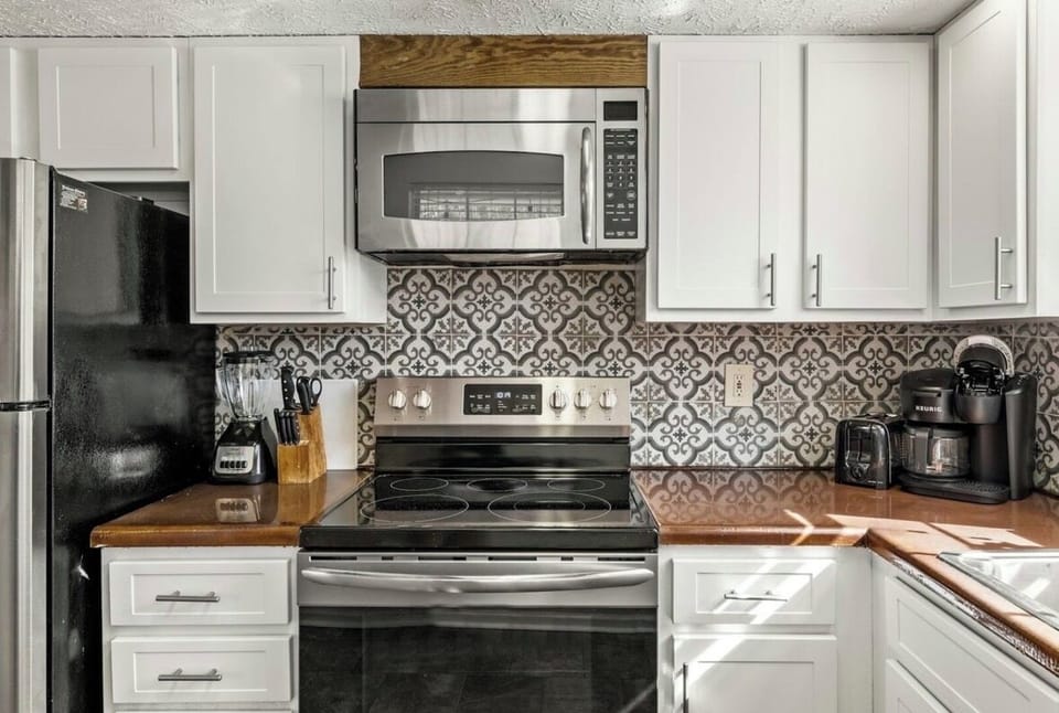 Glasses, plates, utensils, wine opener, cooking utensils, pots and pans and more
