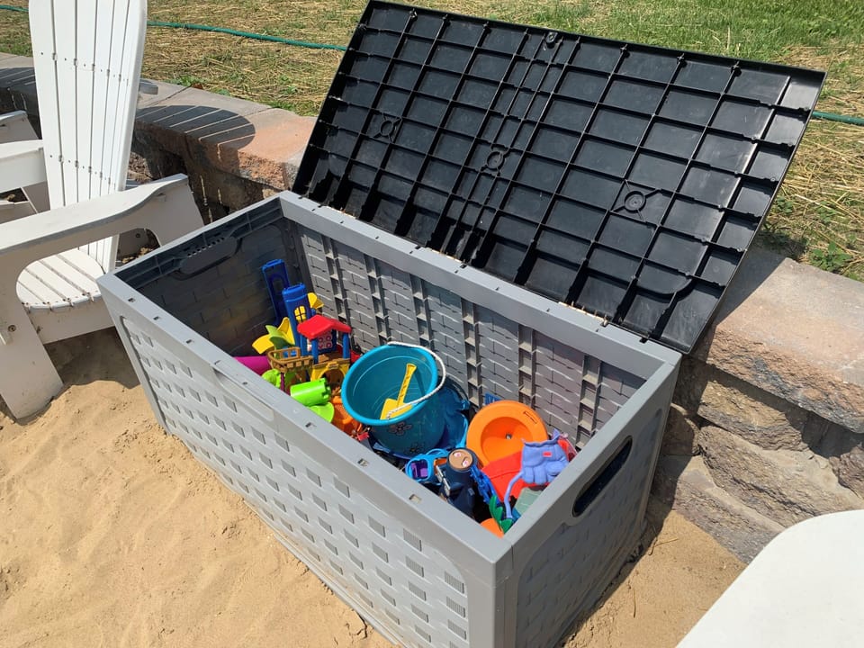 Deck box full of sand toys for our younger guests