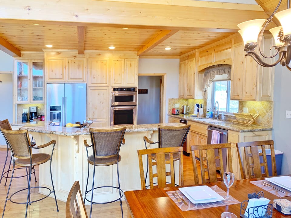 Kitchen with High-end Appliances and Bar Area