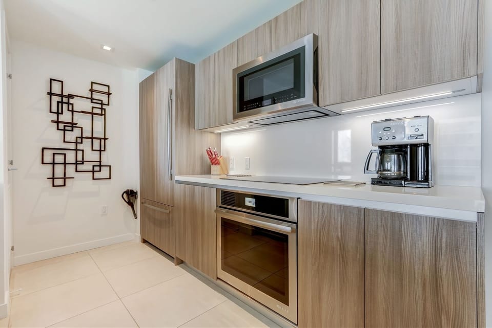 Modern kitchen features a built-in fridge